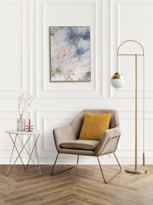 Picture frame by a velvet armchair Picture frame by a velvet armchair